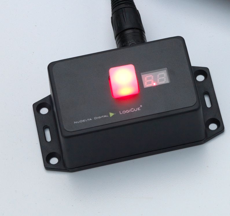 A single QL2 Cue Light, part of the LogiCue Digital Cue Light System. The cue light is red and visible from multiple angles.